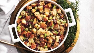 A round white casserole dish filled with our best-ever stuffing.