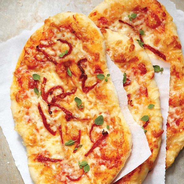 Three-cheese pizza with sun dried tomatoes