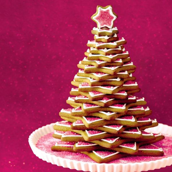 How to make a gingerbread tree: A stunning tree made from gingerbread on a white platter.