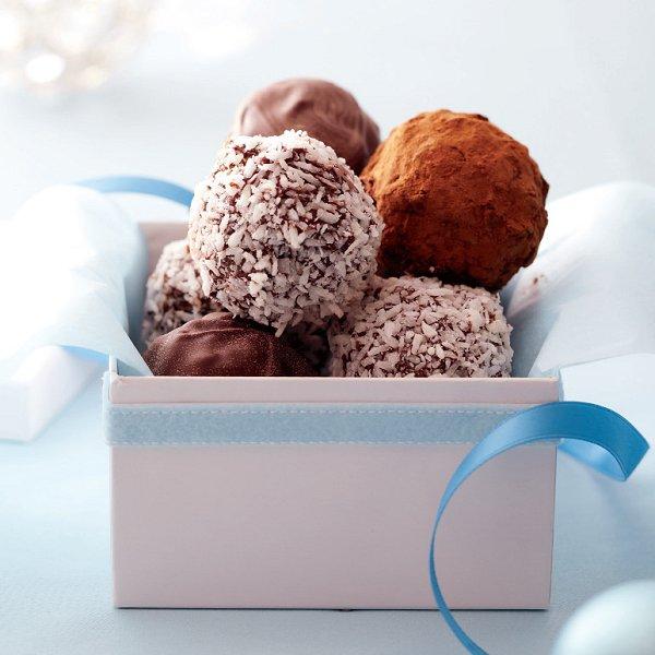 A small gift box filled with chocolate-date truffles.
