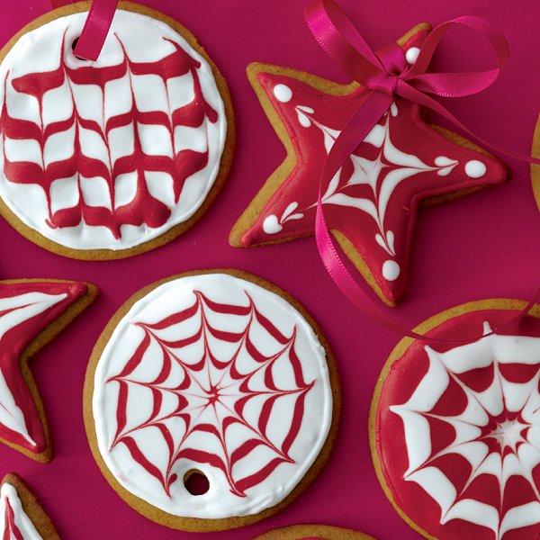 A selection of red-and-white iced gingerbread cookie ornaments