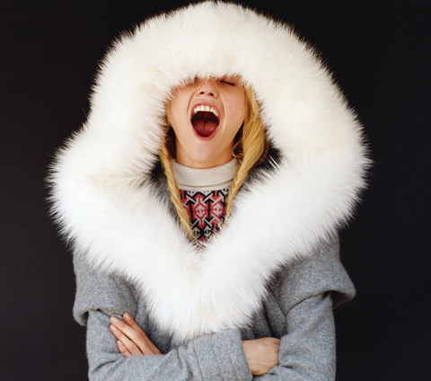 girl in white fur-trimmed coat