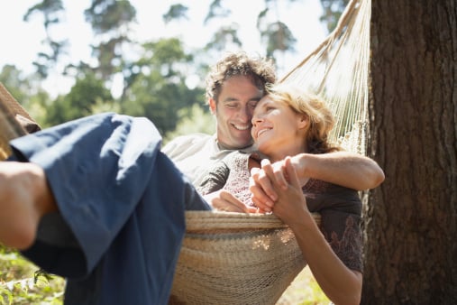 couple smiling in hammock, love