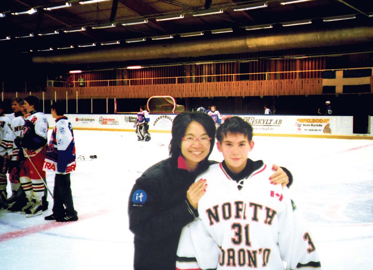 Out of the Blue by Jan Wong, photograph of Jan Wong with son Sam at hockey rink