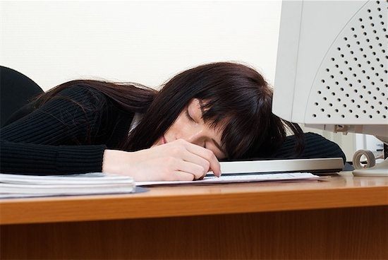 Woman sleeping at desk