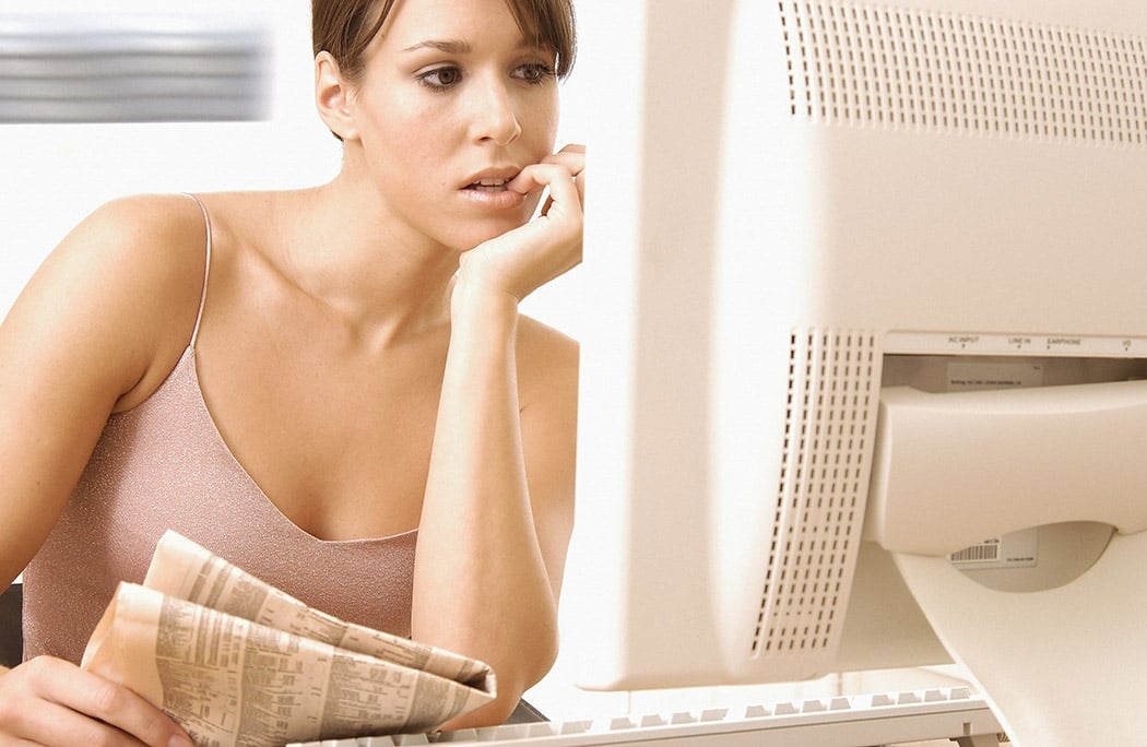 Woman worried at computer