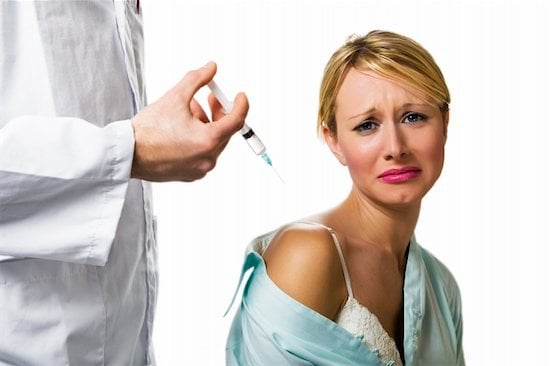 Flu shot, woman getting needle
