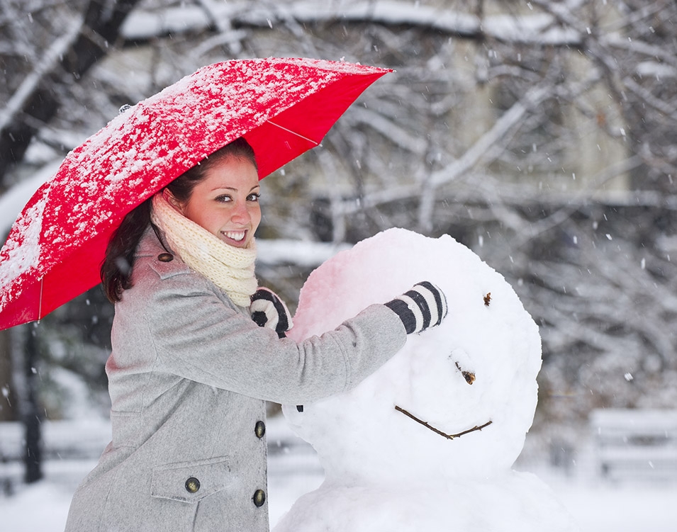 Woman Building a Snowman