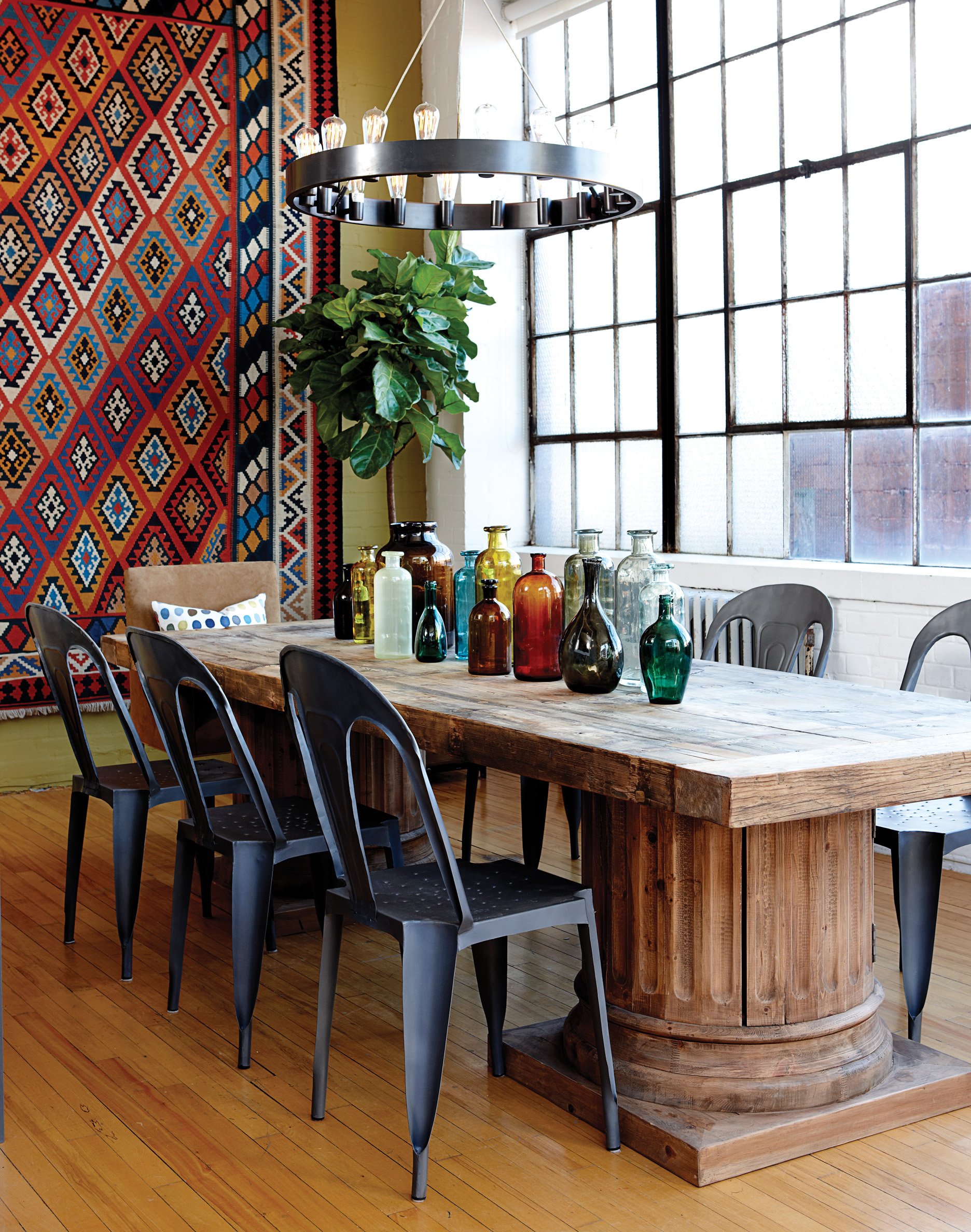 Dining room, glass bottles on table, patterned wall hanging, Jan 13, p62