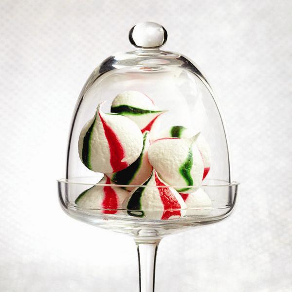 A glass dome filled with peppermint meringue kisses.