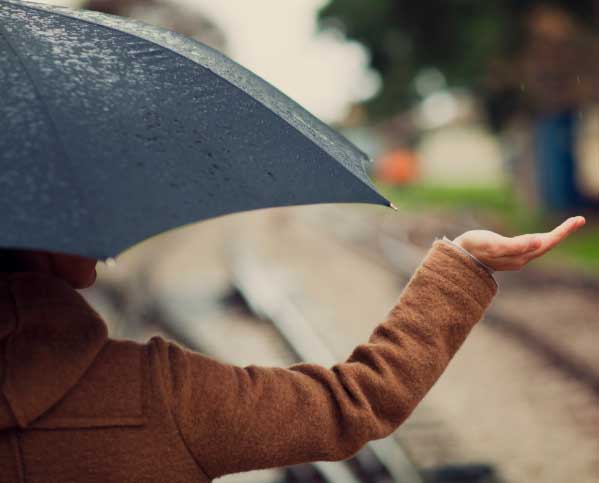 Woman holding an umbrella in the rain