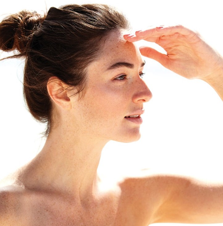 how to get glowing, radiant skin, woman on the beach