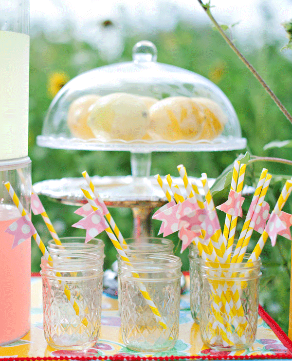 Mason-jar-drinks-lemonade-yellow-straws-pink-flags-backyard-outdoor-party