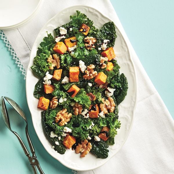 Kale salad with sweet potatoes and walnuts