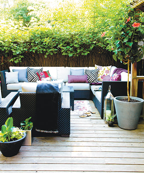 outdoor decorating tips-backyard oasis with couches and pillows