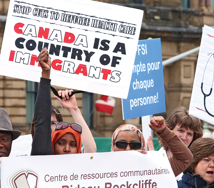 canadians protesting for refugee health care in canada