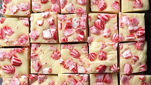 White chocolate peppermint fudge cut into squares, no-bake peppermint fudge recipe
