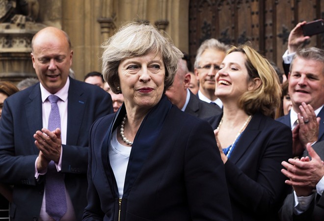 Britain's Theresa May is applauded by Conservative Party members of parliament outside the Houses of Parliament in London, Monday July 11, 2016. Britain's Conservative Party has confirmed that Theresa May has been elected party leader "with immediate effect" and will become the country's next prime minister. Prime Minister David Cameron has said he will step down on Wednesday July 13, 2016 and May will immediately replace him. (Max Nash/AP)