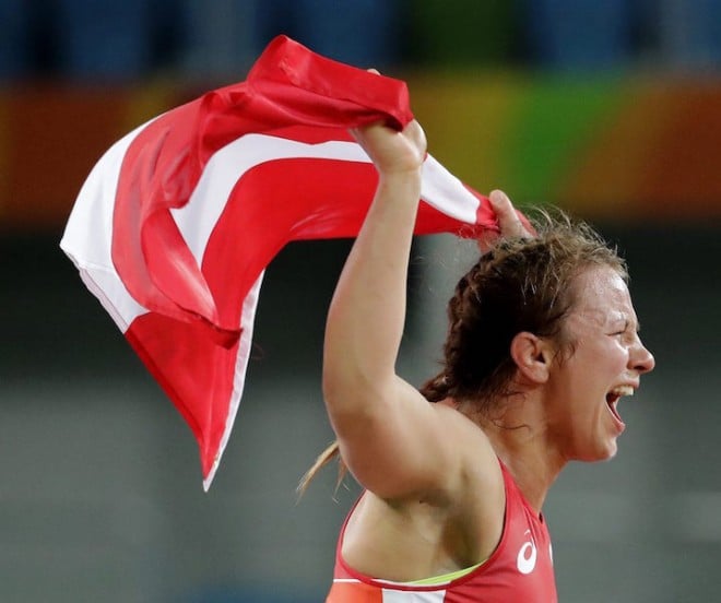 Canada's Erica Elizabeth Wiebe celebrates after beating Kazakhstan's Guzel Manyurova for the gold in the women's wrestling freestyle 75-kg competition at the 2016 Summer Olympics in Rio de Janeiro, Brazil, Thursday, Aug. 18, 2016. (AP Photo/Charlie Riedel)