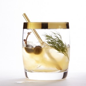 Savoury vodka cocktail with caper berries and dill
