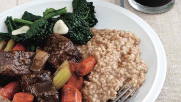 Irish recipes: Plate of stout-briased Irish Stew with greens and carrots