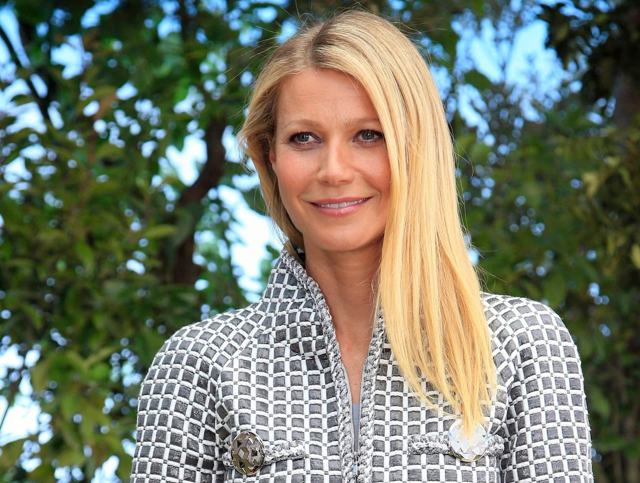 Gwyneth Paltrow poses for photographers before Chanel's Spring-Summer 2016 Haute Couture fashion collection in Paris. Paltrow hosted the inaugural "In Goop Health" event Saturday, June 10, 2017, in Culver City, California, where about 600 women spent the day chatting, learning, eating, shopping and generally indulging in the designer-wellness lifestyle touted by goop.com. (AP Photo/Thibault Camus, File)