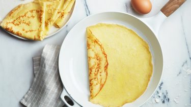 Crepes recipe: crepes folded on white serving plate