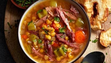 split pea and ham soup with chives on the side