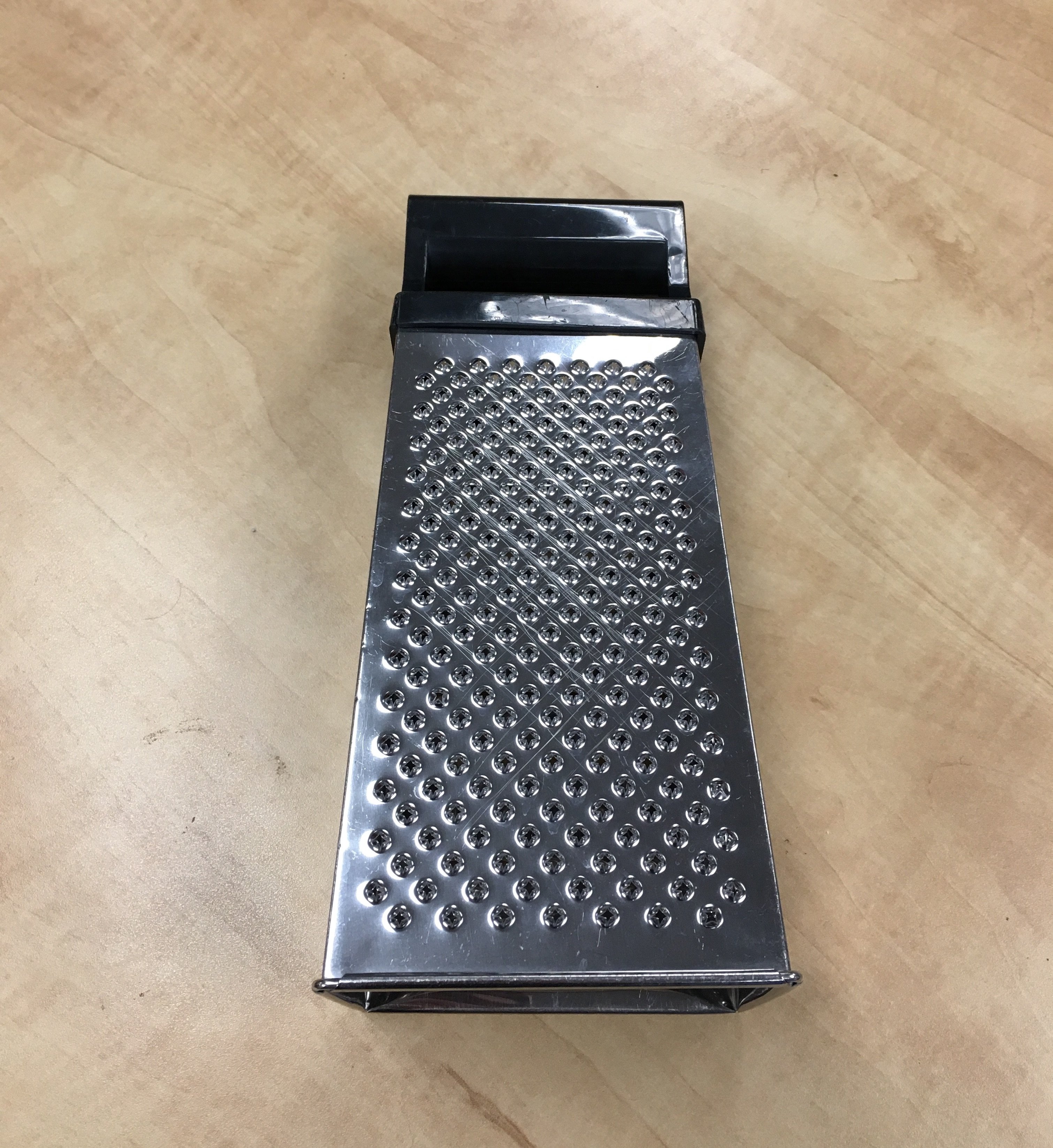 Use this side of a box grater for fine dustings of cheese.