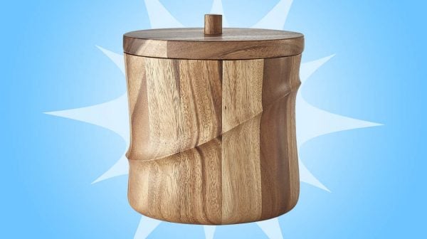 photo of a a wood ice bucket for cb2 on a blue background