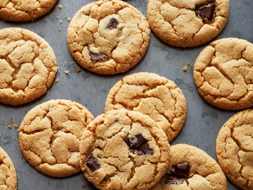 Chatelaine' best cookie recipes: classic peanut butter cookies and peanut butter cookies with chocolate chunks on a silver cookie sheet