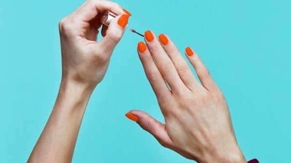 one of the biggest beauty trends for spring is orange nail polish