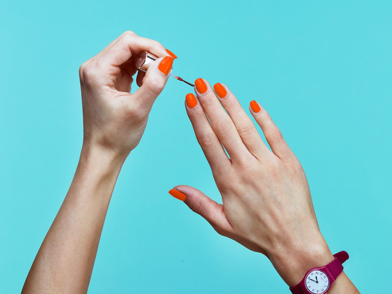 nail design with orange polish