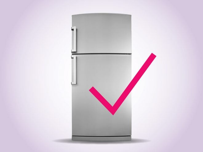 refrigerator on purple background with a pink checkmark in front of the door