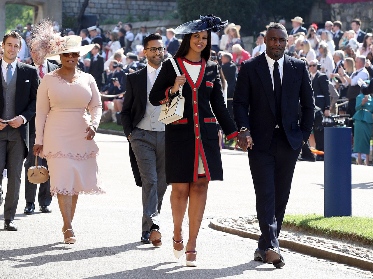 Idris Elba and Sabrina Dhowre followed by Oprah Winfrey at the royal wedding of Meghan Markle and Prince Harry