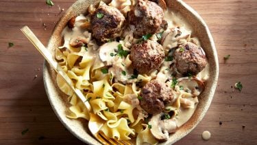 easy dinner recipes-saucy swedish meatballs and egg noddles with sauce in a bowl