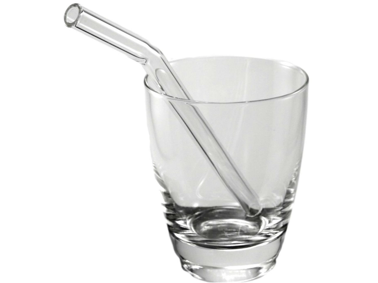 Glass straw in glass cup