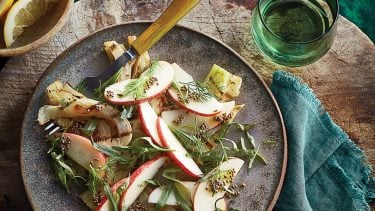 Grilled apple salad on a stoneware plate