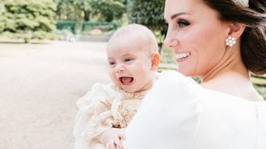 The Duchess holding a laughing Prince Louis on the day of his Christening