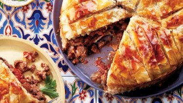 Lamb pie with a slice cut out