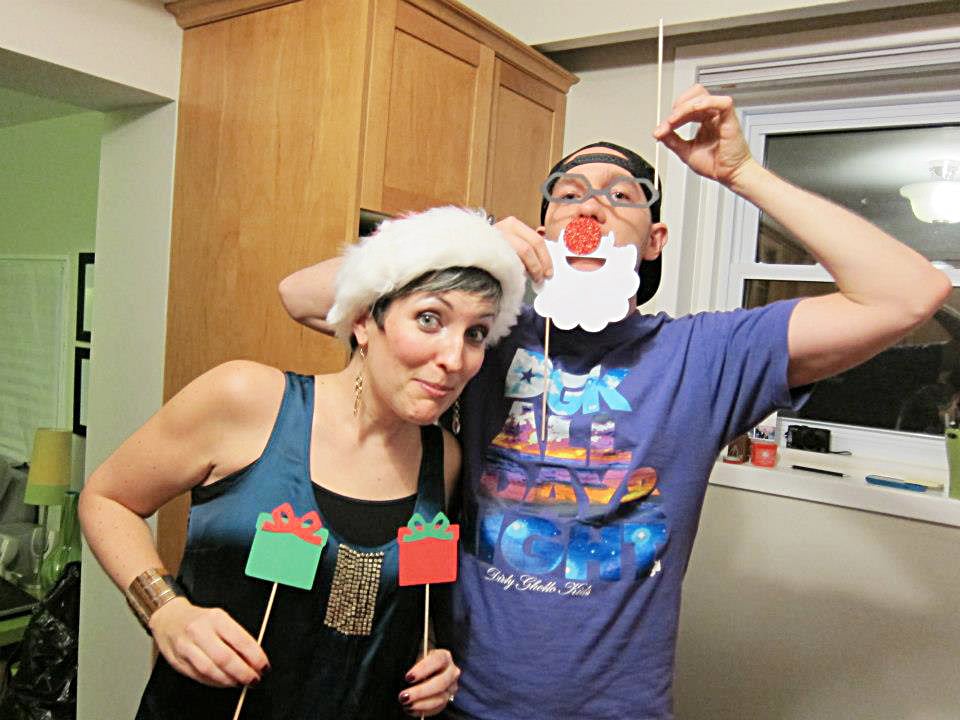 opioid addiction stigma-two adults wear christmas hats and fake white santa beards