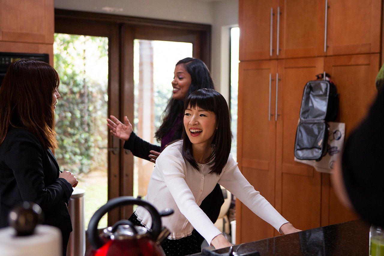 tidying up with marie kondo show: kondo and two women work through kitchen