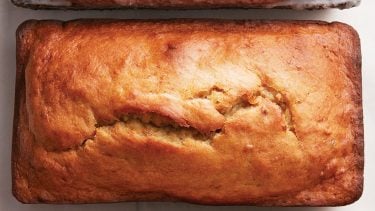 classic banana bread recipe: banana bread loaf on white background
