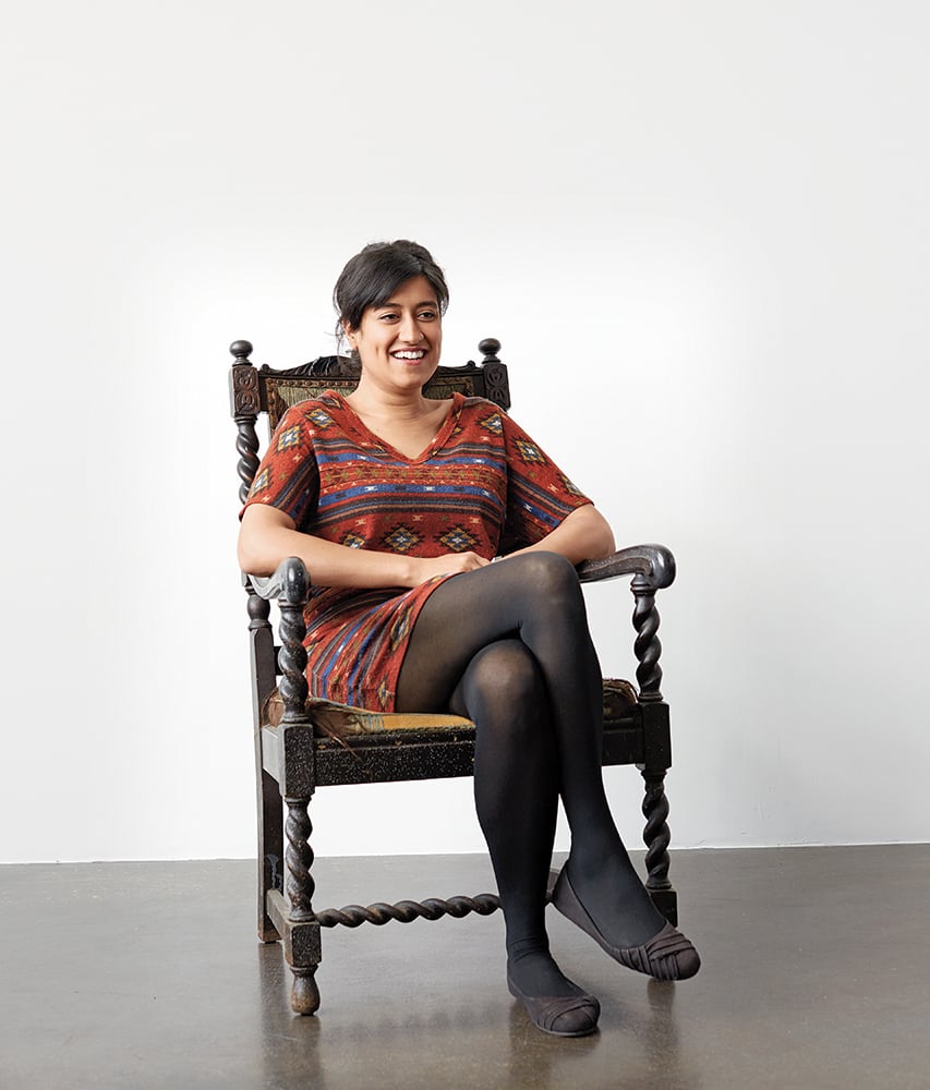 Ms. Chatelaine Aminder Dhaliwal sits in a chair