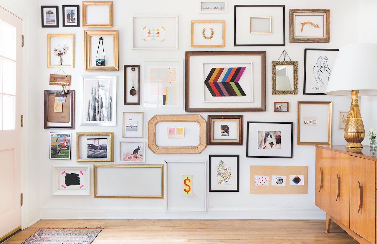 gallery wall-an assortment of framed art on a white wall