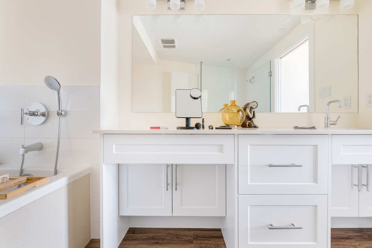 Jenna Reed-Côté's universal design renovations: tub with handheld shower head, counter with recessed cabinets for leg space
