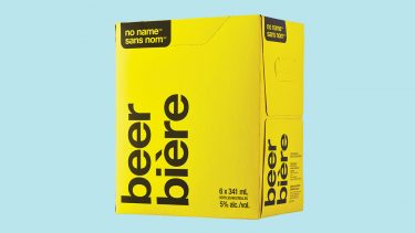 A yellow box of no name beer on a blue background for a review of No Name brand beer, now available in Ontario at the LCBO.