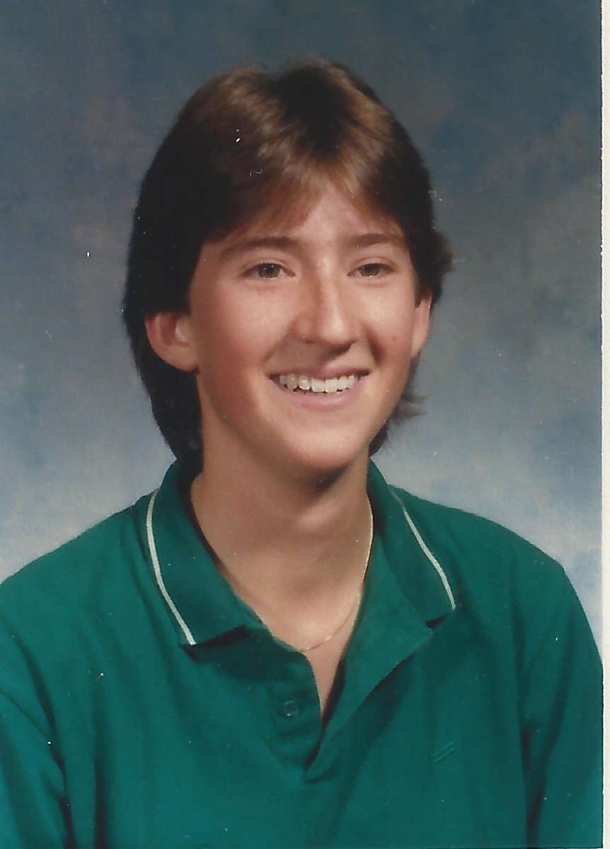 This One Looks Like A Boy Lorimer Schenher-high school photo of Lorimer Shenher wearing a green polo shirt