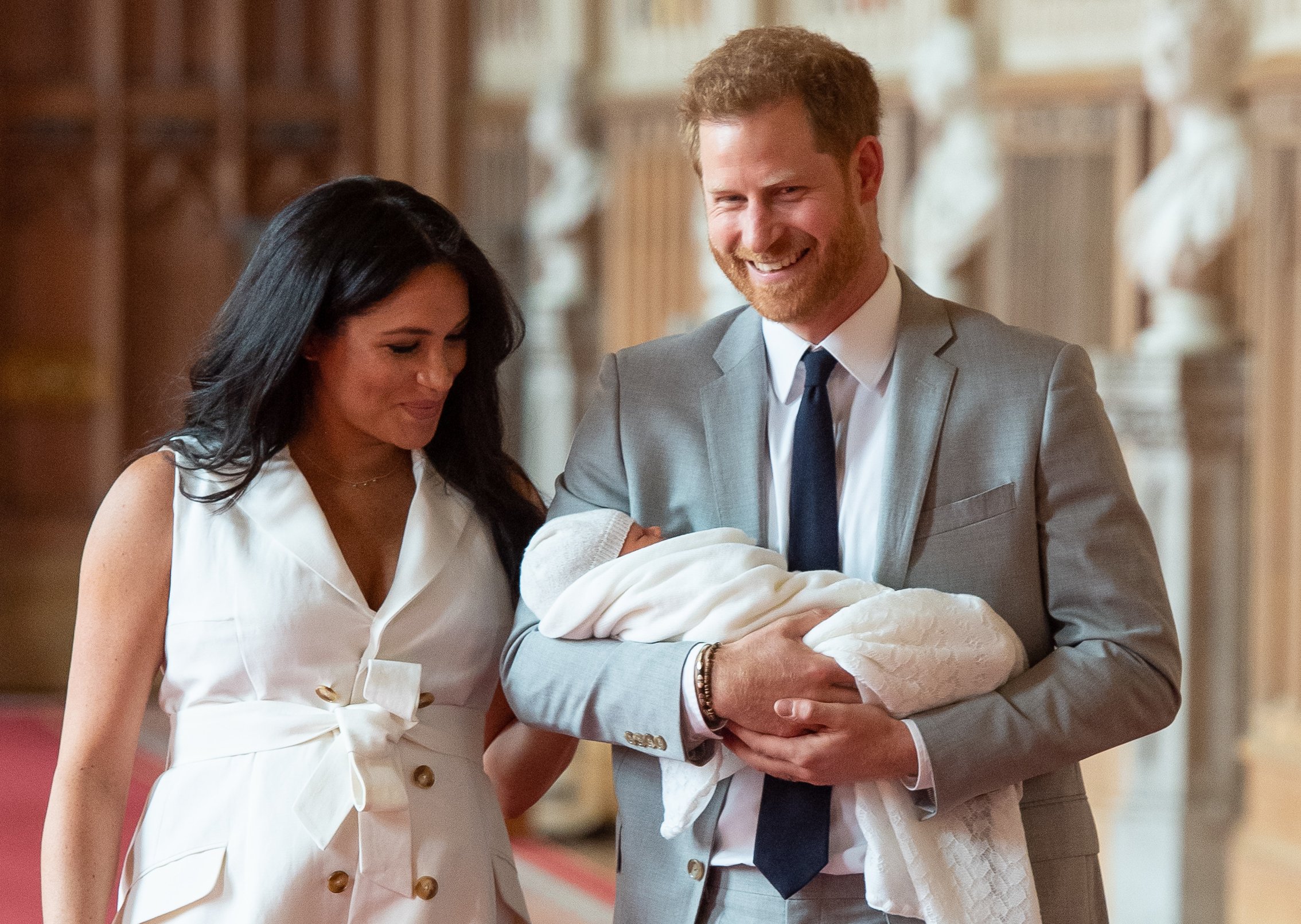 Prince Harry, and Meghan, Duchess of Sussex, pose for a photo with their newborn baby son