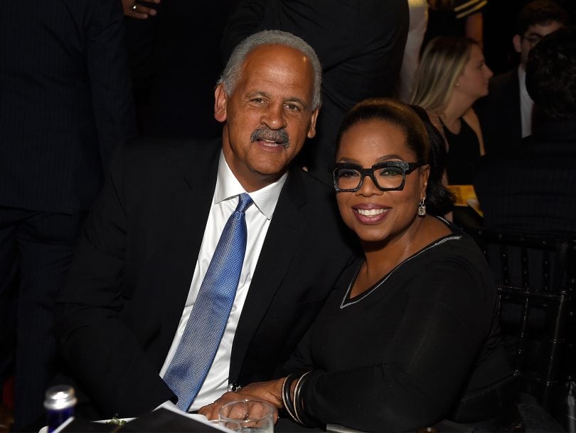 Oprah and Steadman Graham at the Robin Hood Foundation's 2018 Benefit, sitting closely together and smiling.